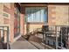 Cozy front porch with seating, creating a welcoming outdoor space for relaxation and enjoyment at 2042 Jamaica St, Aurora, CO 80010