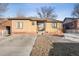 Charming brick home with a well-maintained front yard and inviting curb appeal, ready for new owners at 2042 Jamaica St, Aurora, CO 80010