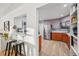 Modern kitchen featuring stainless steel appliances, two-tone cabinetry, and a breakfast bar at 2042 Jamaica St, Aurora, CO 80010