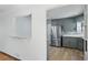 Stylish kitchen with stainless steel appliances, gray cabinets, and an adjacent breakfast bar at 2042 Jamaica St, Aurora, CO 80010