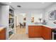 Bright kitchen featuring two-tone cabinetry, sleek countertops, and a pass-through window at 2042 Jamaica St, Aurora, CO 80010
