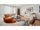 Cozy living room with hardwood floors, a comfortable sofa, and stylish decor at 2042 Jamaica St, Aurora, CO 80010