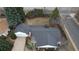 Aerial view showcasing the roof, surrounding trees, and long driveway of a suburban home at 3201 S Albion St, Denver, CO 80222