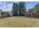 Large backyard with mature trees and a well-maintained lawn, creating a serene outdoor space at 3201 S Albion St, Denver, CO 80222
