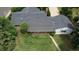 Aerial view of backyard featuring a covered patio, mature trees, and lush greenery at 3201 S Albion St, Denver, CO 80222