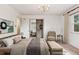 Neutral bedroom with a walk-in closet and view into an adjacent room at 3201 S Albion St, Denver, CO 80222