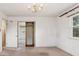 Bedroom featuring mirrored closet doors and natural light at 3201 S Albion St, Denver, CO 80222