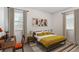 Cozy bedroom features bright yellow bedding, a modern desk area, and natural light from two large windows at 3201 S Albion St, Denver, CO 80222