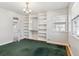 Bright bedroom featuring built-in shelving and lots of natural light at 3201 S Albion St, Denver, CO 80222