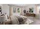 Bright bedroom featuring a large window, neutral decor, and modern furniture at 3201 S Albion St, Denver, CO 80222