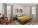 Cozy bedroom featuring bright yellow bedding, two windows, and a desk at 3201 S Albion St, Denver, CO 80222