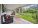 Relaxing covered patio with outdoor seating, overlooking the spacious backyard and lush greenery at 3201 S Albion St, Denver, CO 80222