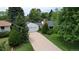 Aerial view of a single-Gathering home with a large driveway and well-maintained landscaping at 3201 S Albion St, Denver, CO 80222