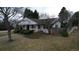 Quaint home featuring a covered porch, tidy front yard, and a classic suburban aesthetic at 3201 S Albion St, Denver, CO 80222