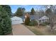 Charming single-story home features an attached garage, mature landscaping, and a cozy, covered front porch at 3201 S Albion St, Denver, CO 80222