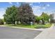 Home exterior with mature trees, a well-maintained lawn, and a 'For Sale' sign in the front yard at 3201 S Albion St, Denver, CO 80222