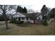 Quaint one-story home featuring a covered porch, mature trees and landscaping in front yard at 3201 S Albion St, Denver, CO 80222