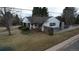 Front aerial view of a home with trimmed bushes and nearby trees at 3201 S Albion St, Denver, CO 80222