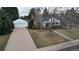Inviting exterior with a two-car garage, mature trees, and a well-kept lawn enhancing curb appeal at 3201 S Albion St, Denver, CO 80222
