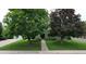 Charming home featuring mature trees, a well-manicured lawn, and inviting curb appeal at 3201 S Albion St, Denver, CO 80222