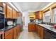 Functional kitchen layout with ample counter space, cabinetry, and a stainless steel refrigerator at 3201 S Albion St, Denver, CO 80222