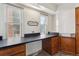 Practical laundry room with ample counter space, storage cabinets, and natural light at 3201 S Albion St, Denver, CO 80222