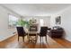 Cozy living room with a fireplace, hardwood floors, and large windows at 3201 S Albion St, Denver, CO 80222