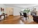 Spacious living room featuring hardwood floors, fireplace, and a view of the entry way and front door at 3201 S Albion St, Denver, CO 80222