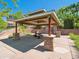 Outdoor pavilion with stone accents, offering a shaded seating area at 3662 S Perth Cir # 104, Aurora, CO 80013
