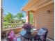 Cozy porch with outdoor furniture and a picturesque view of the surrounding landscape at 3662 S Perth Cir # 104, Aurora, CO 80013