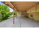 Spacious covered back patio with a concrete slab, offering a great outdoor living space at 6953 Ingalls St, Arvada, CO 80003