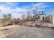 Large concrete backyard with wooden fence, offers privacy and potential for outdoor activities and customization at 1517 W Nevada Pl, Denver, CO 80223