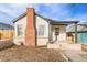 Quaint bungalow with brick chimney and porch at 1517 W Nevada Pl, Denver, CO 80223