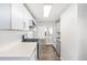 Stylish kitchen with stainless steel gas range and oven and wood-look flooring at 1517 W Nevada Pl, Denver, CO 80223