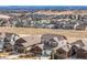 Scenic aerial view of a residential neighborhood nestled in a picturesque landscape at 17786 W 86Th Ln, Arvada, CO 80007