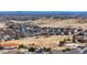 Overhead view of a residential area with many houses, parks, and playgrounds at 17786 W 86Th Ln, Arvada, CO 80007