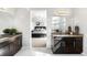 Spacious bathroom showcases and vanities, a walk-in shower, and access to the main bedroom at 17786 W 86Th Ln, Arvada, CO 80007
