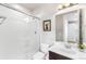 Bathroom boasts a modern glass shower, sleek fixtures, vanity, and decorative accents at 17786 W 86Th Ln, Arvada, CO 80007