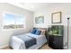 Comfortable bedroom featuring a cozy bed, scenic view, and unique aquarium feature at 17786 W 86Th Ln, Arvada, CO 80007