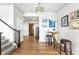 Welcoming entryway featuring modern decor, hardwood floors, and access to other rooms at 17786 W 86Th Ln, Arvada, CO 80007
