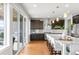 Beautiful kitchen with an island, modern appliances, and access to the outdoor patio at 17786 W 86Th Ln, Arvada, CO 80007