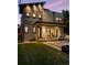 Modern home exterior with a well-manicured backyard and patio seating, creating an inviting outdoor living space at 1100 S Gilpin St, Denver, CO 80210