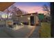 Backyard patio features outdoor fireplace with seating in a private setting perfect for relaxing at 1100 S Gilpin St, Denver, CO 80210