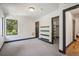 Bedroom with contemporary design, large windows, and view into a large walk-in closet at 1100 S Gilpin St, Denver, CO 80210