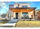 Contemporary home featuring a stylish covered porch, modern architecture, and well-manicured landscaping at 1100 S Gilpin St, Denver, CO 80210