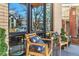 Inviting front porch featuring comfortable seating, stylish decor, and a view of the neighborhood at 1100 S Gilpin St, Denver, CO 80210