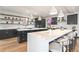 Bright kitchen features modern cabinetry, white countertops, stainless steel appliances, and hardwood floors at 1100 S Gilpin St, Denver, CO 80210