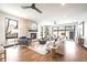 Spacious living room features hardwood floors, modern fireplace, and comfortable seating at 1100 S Gilpin St, Denver, CO 80210