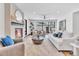 Bright living room highlights a modern fireplace, stylish decor, and comfortable furniture at 1100 S Gilpin St, Denver, CO 80210