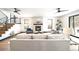 Open-concept living room features a modern fireplace, staircase, and comfortable seating area at 1100 S Gilpin St, Denver, CO 80210